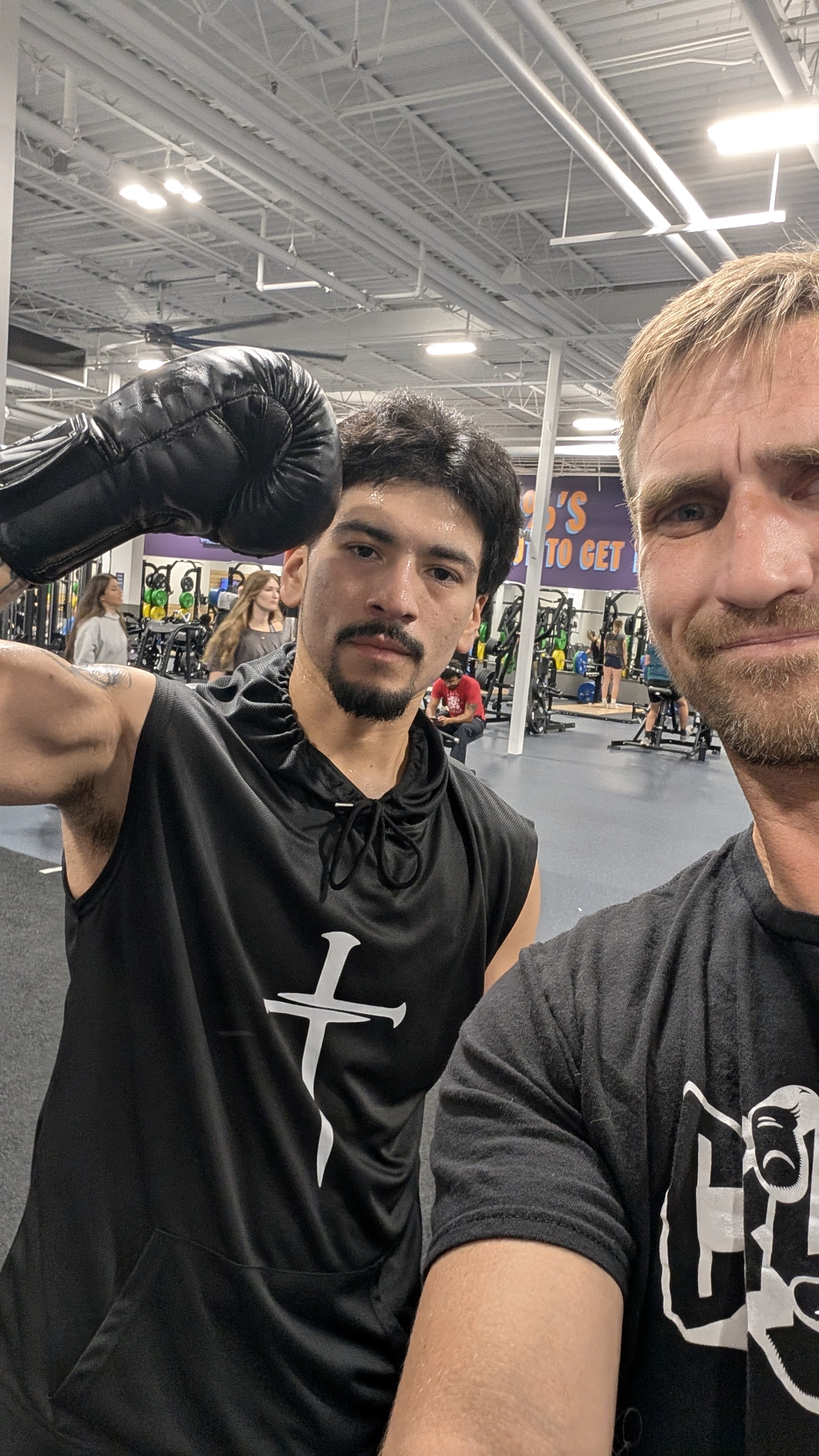 Jonathon Guyer with a boxing student at the gym