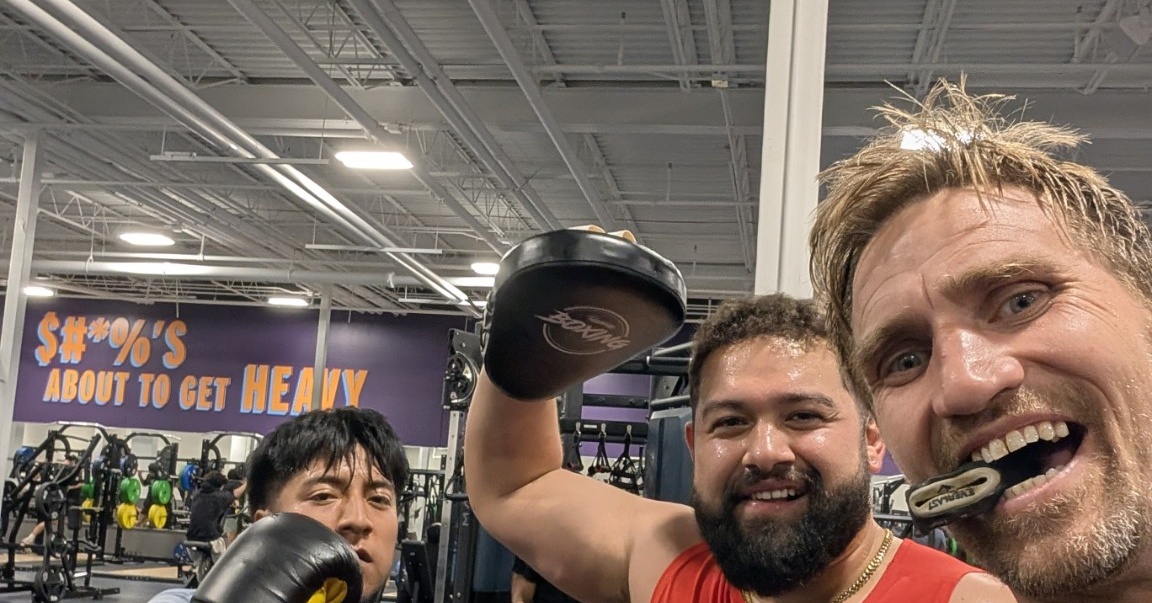 Jonathon Guyer and boxing students training at the gym